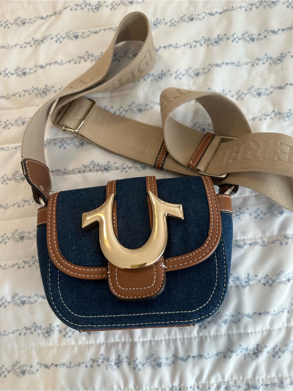 True Religion Blue Denim Crossbody with Tan Leather Trim and Gold Logo